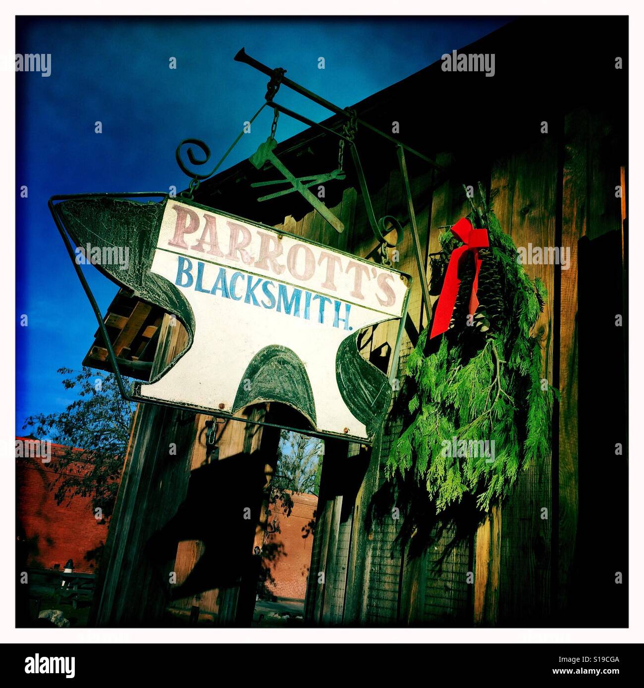 The blacksmith on Main Street during the Christmas season. Columbia State Historic Park, Columbia, Tuolumne County,  California, USA - Smartphone Captured Stock Image