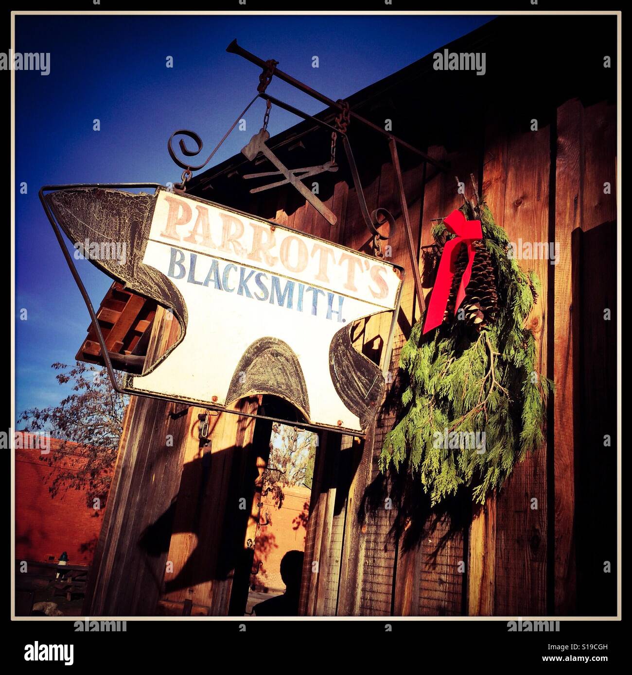 The blacksmith on Main Street during the Christmas season. Columbia State Historic Park, Columbia, Tuolumne County,  California, USA - Smartphone Captured Stock Image