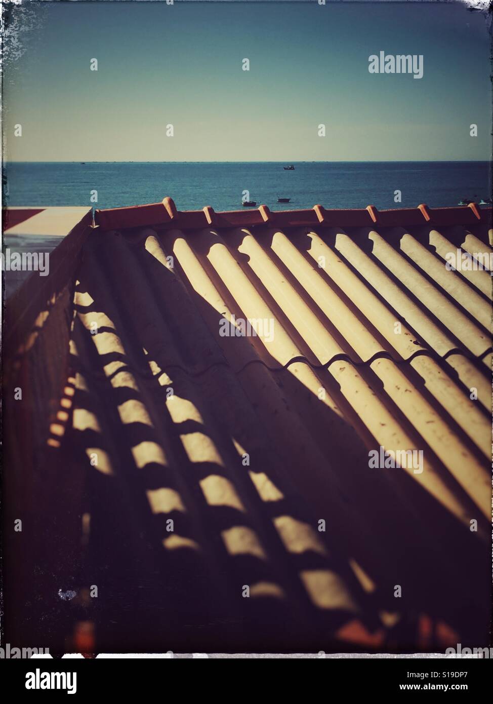 Outside light falling on the roof making shadows. - Smartphone Captured Stock Image