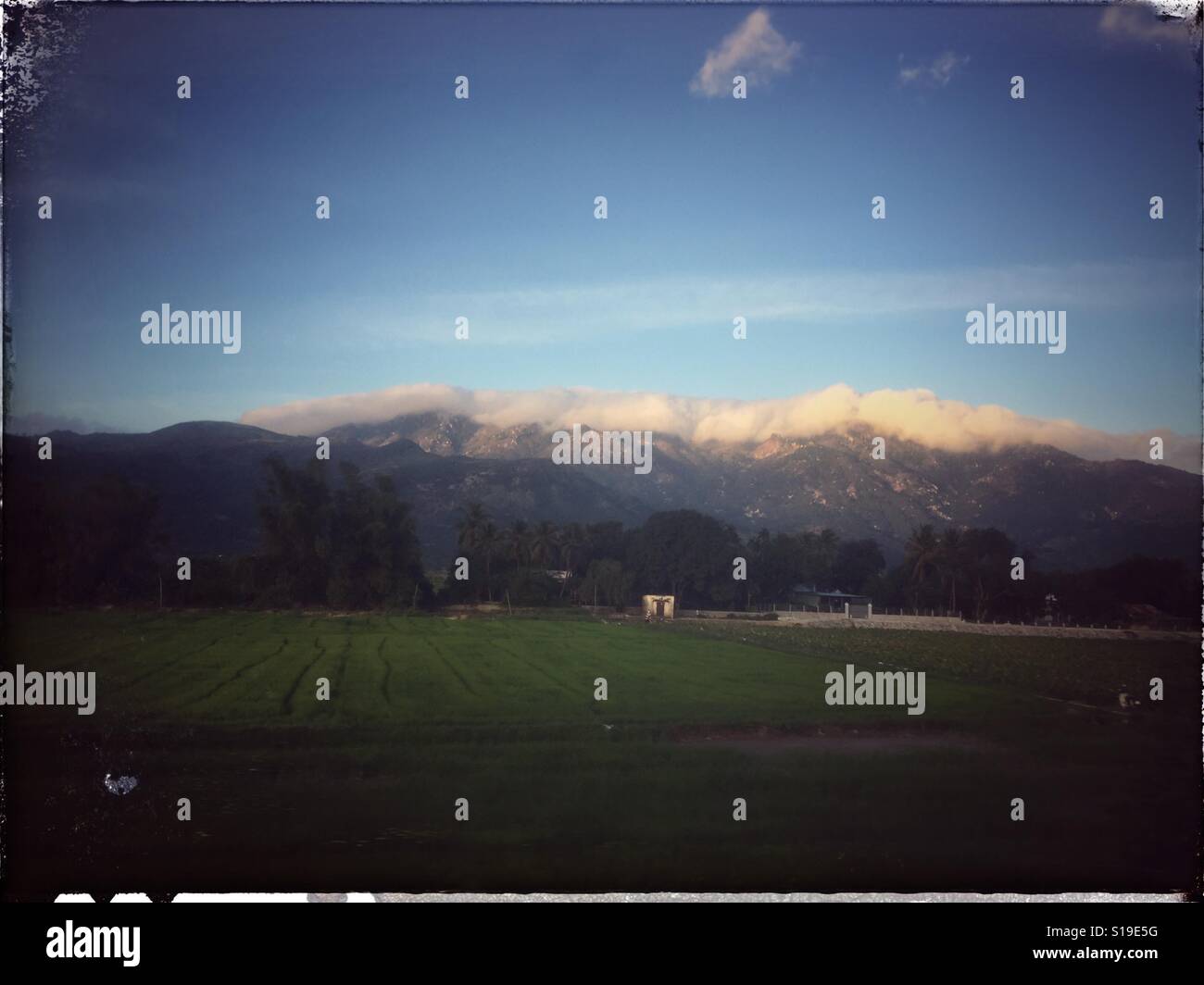 Clouds hovering over the mountains. - Smartphone Captured Stock Image