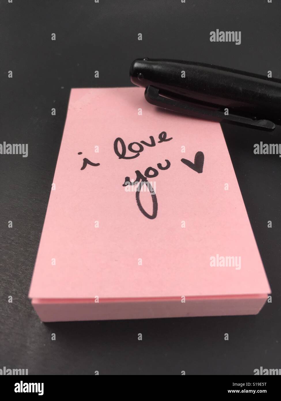 hand writen note. I LOVE YOU on a sticky note Stock Photo
