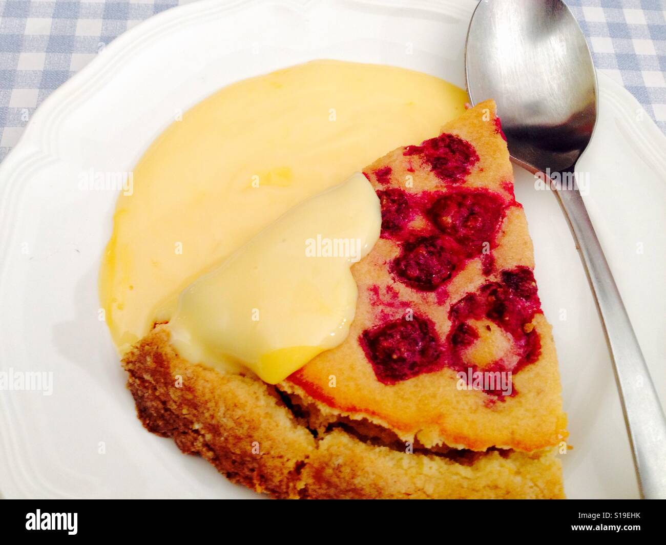 Homemade Scottish raspberry and almond tart with custard - Smartphone Captured Stock Image
