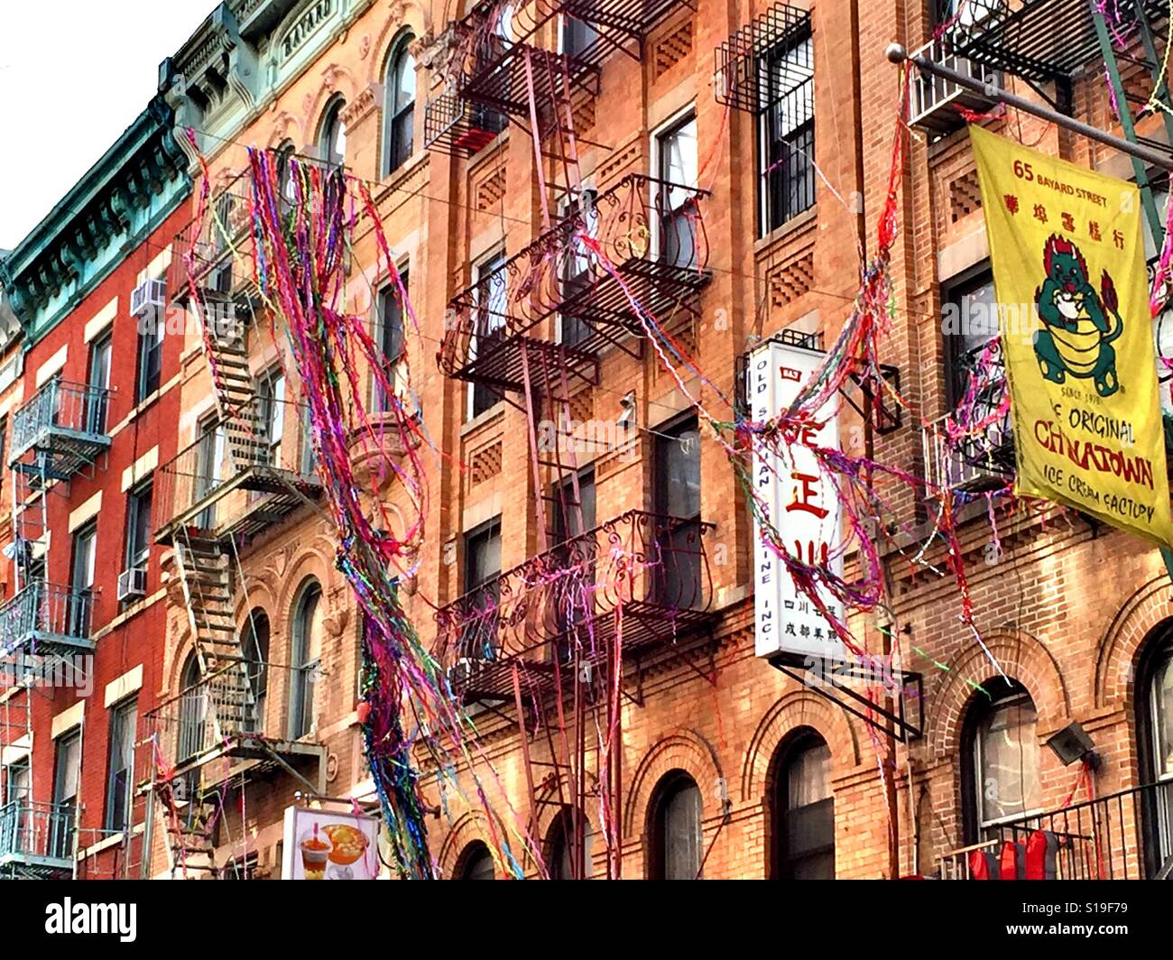 Apartment building with fire escapes  in Chinatown, NYC, USA - Smartphone Captured Stock Image