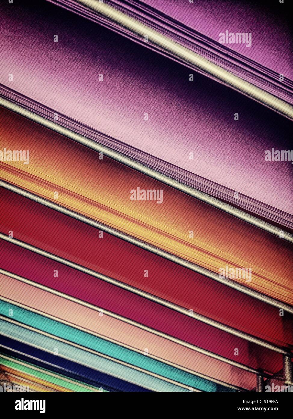 Colored paper on display shelves in art supply store, USA Stock Photo