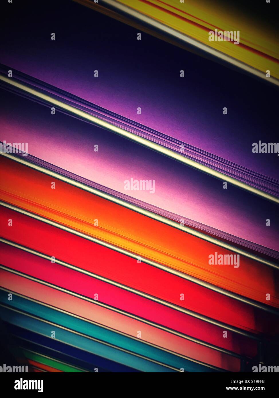 Colored paper displayed in shelves in art supply store, USA Stock Photo