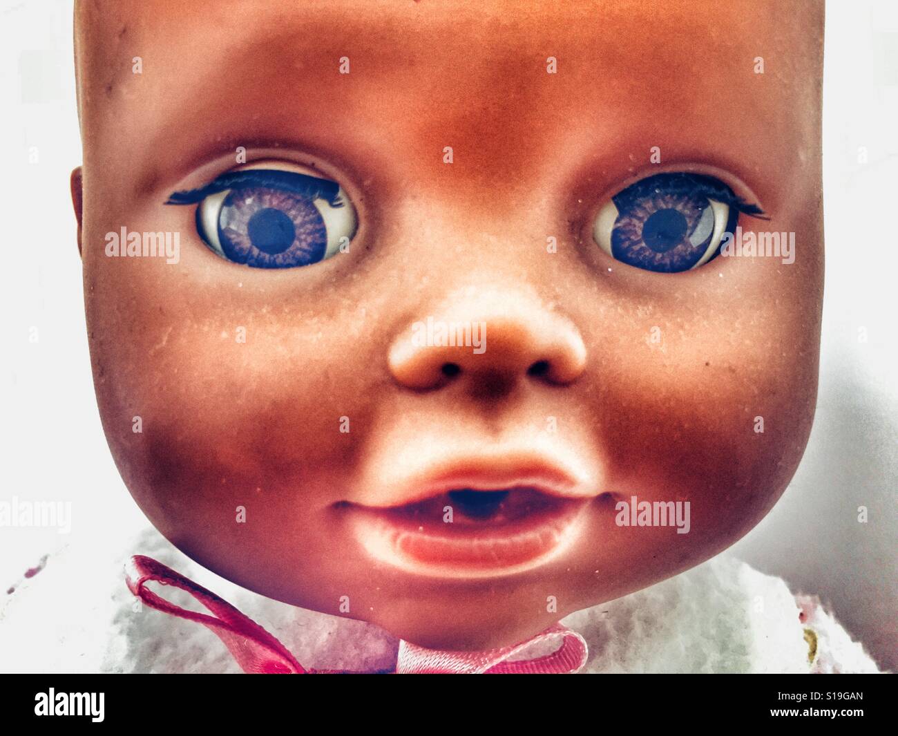 Baby doll face, creepy - Smartphone Captured Stock Image