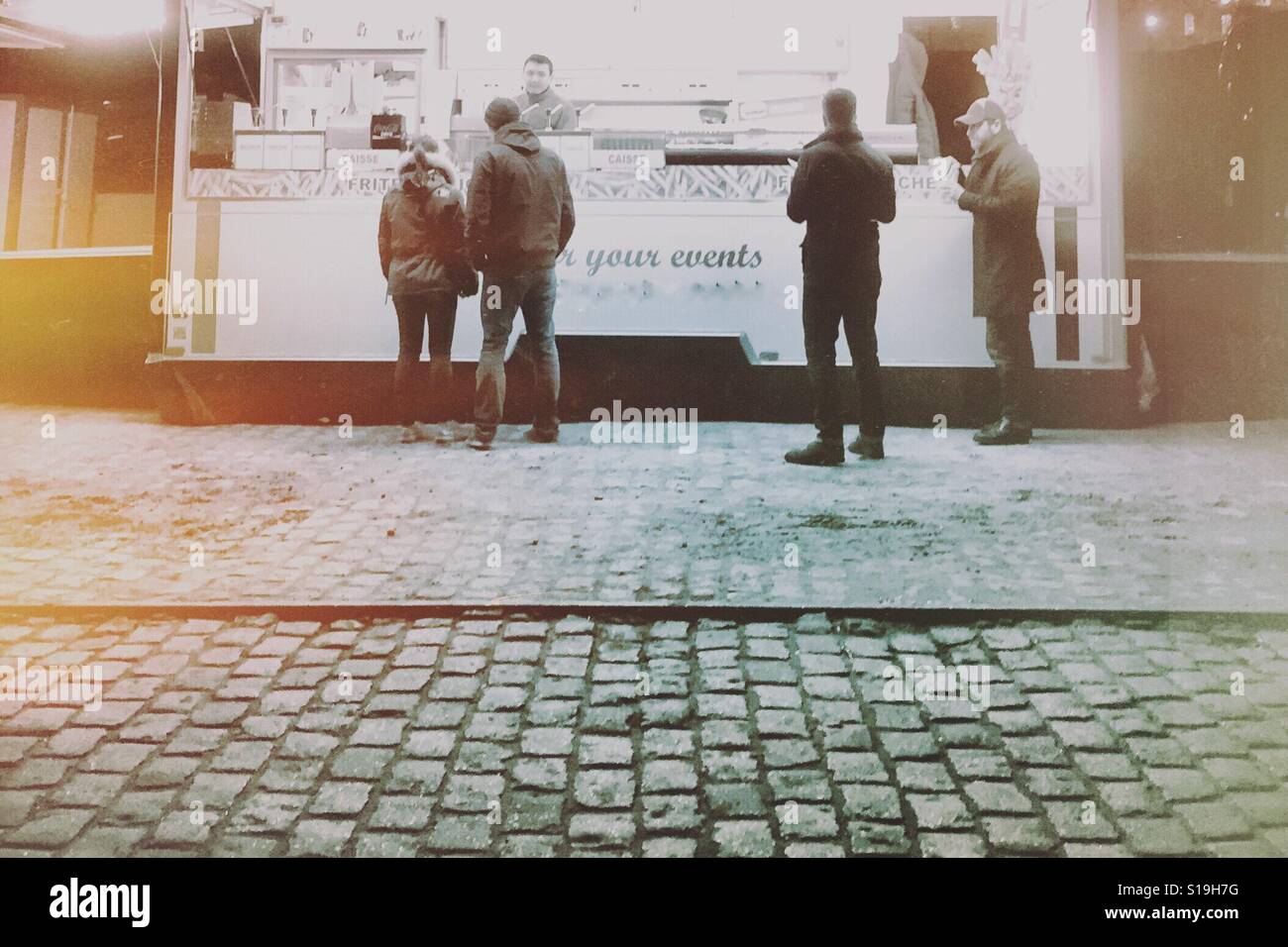 Food truck on cobblestone street - Smartphone Captured Stock Image