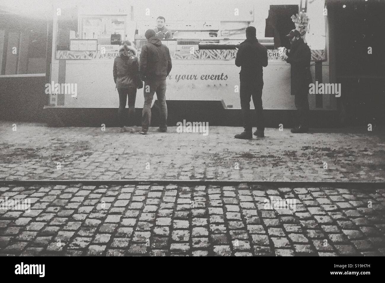 Food truck on cobblestone road - Smartphone Captured Stock Image