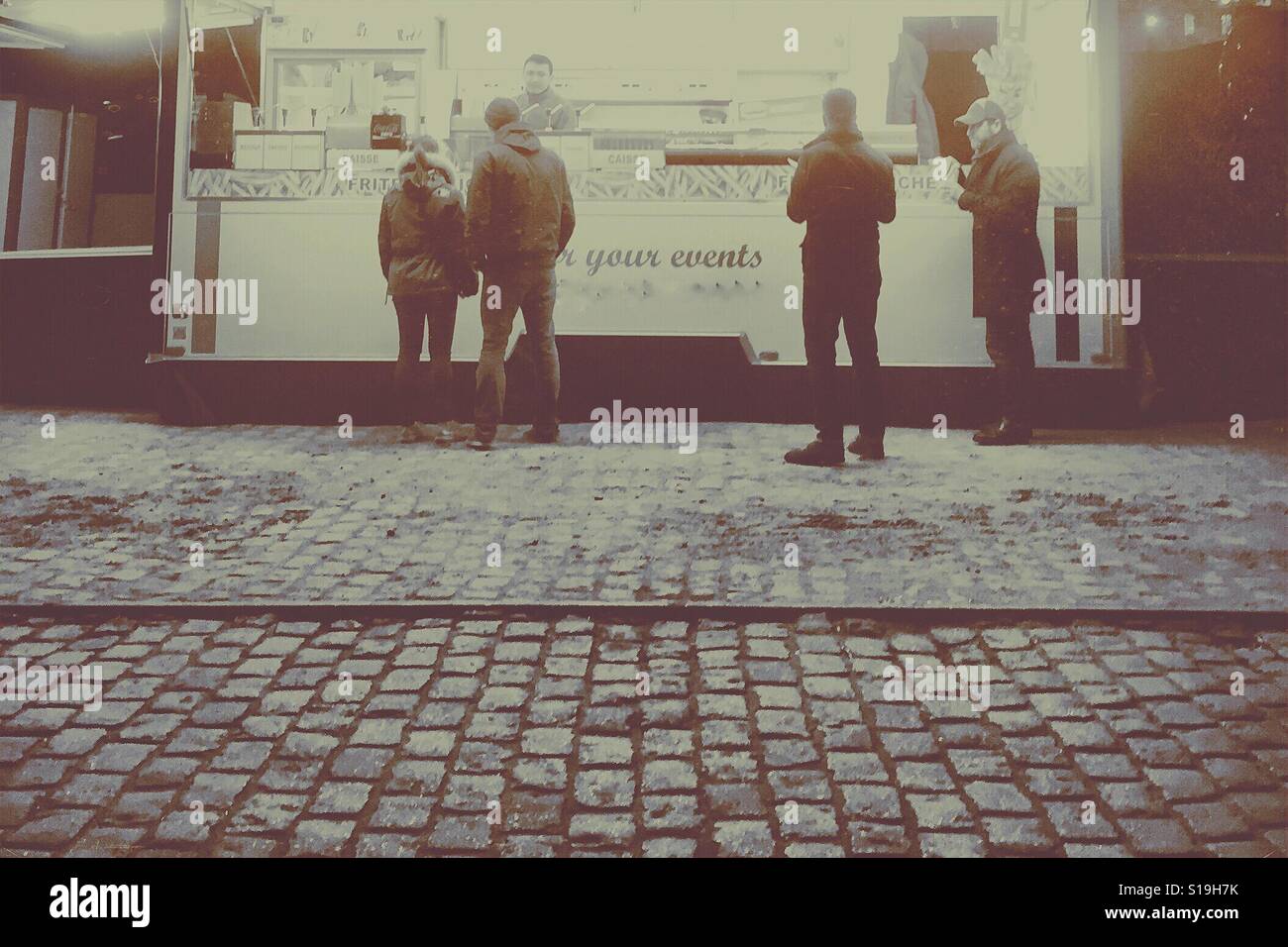 Food truck on cobblestone road - Smartphone Captured Stock Image