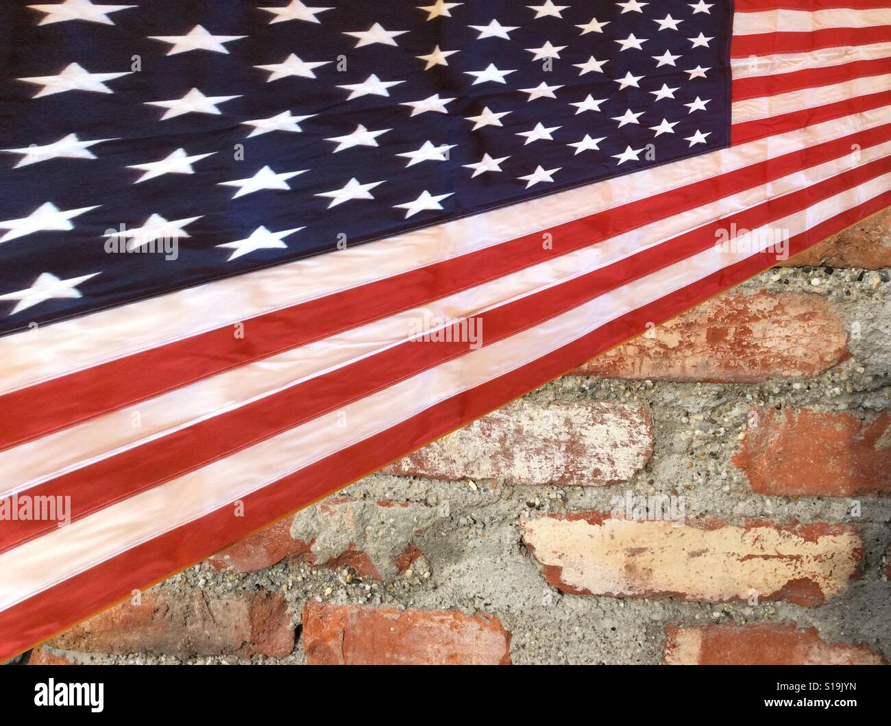 American Stars and Stripes flag on brick wall Stock Photo Alamy