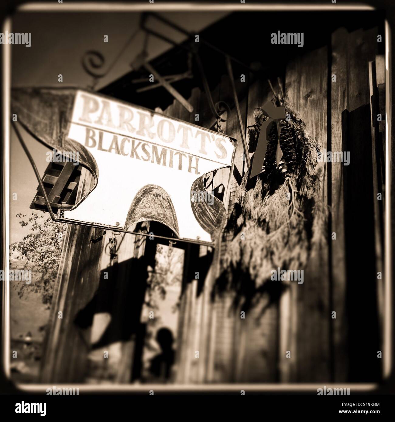 The blacksmith on Main Street during the Christmas season. Columbia State Historic Park, Columbia, Tuolumne County,  California, USA - Smartphone Captured Stock Image