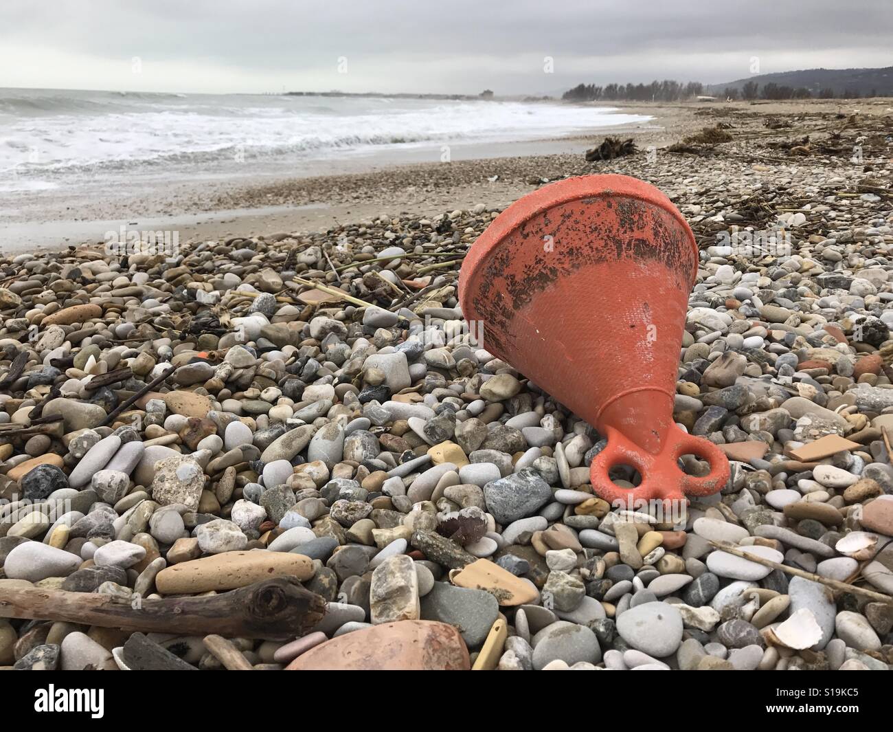 Stones beach and abandones buoy view, Sentina Natural Reserve, Italy - Smartphone Captured Stock Image