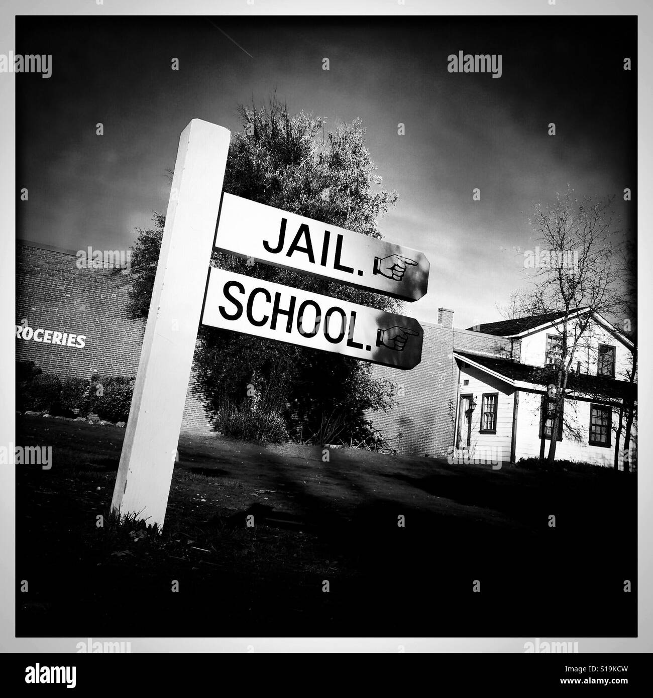 Jail and school sign on Main Street. Columbia State Historic Park, Columbia, Tuolumne County,  California, USA Stock Photo
