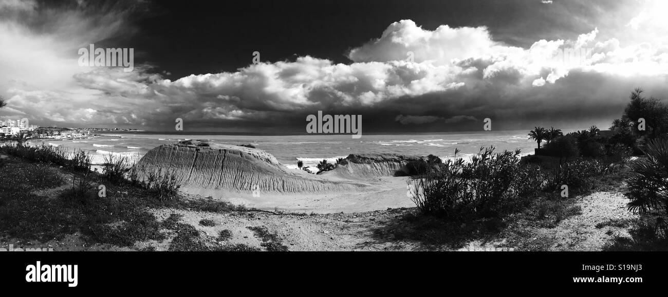 Cloudy sky and Mediterranean Sea. Panoramic view. Black and white. Spain Stock Photo