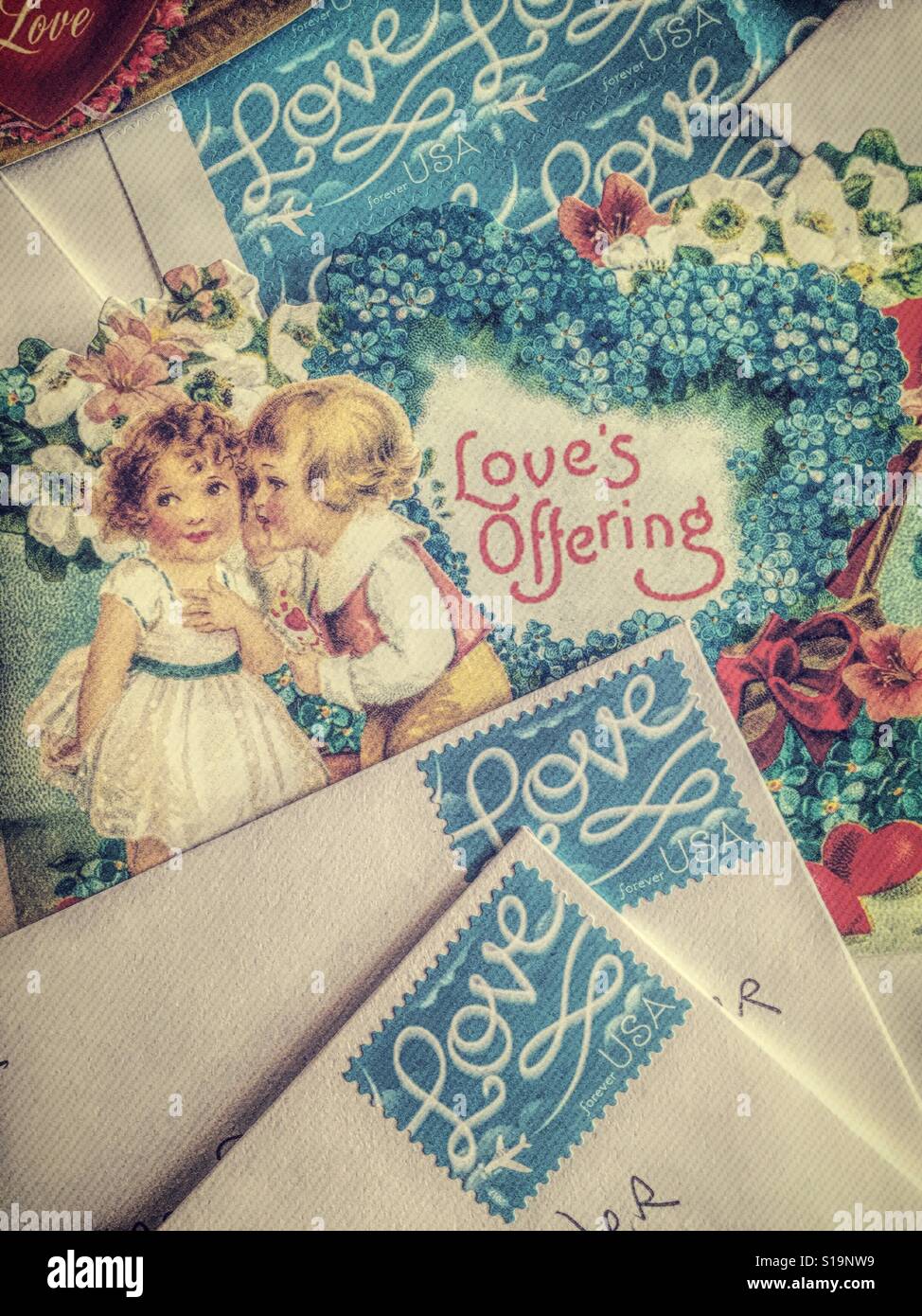 Valentine's Day cards ready to mail with love stamps, USA - Smartphone Captured Stock Image