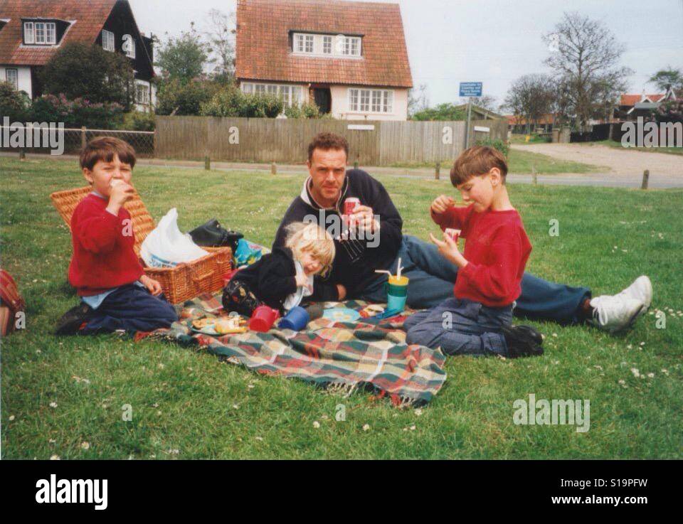 Family picnic on green grass Stock Photo