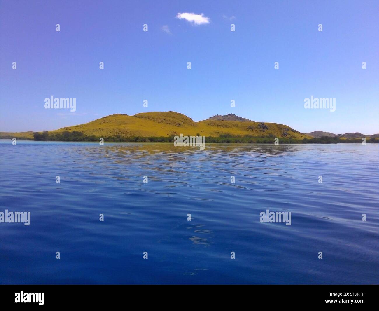 Komodo Islands Landscape From Ocean in Flores Sea Stock Photo
