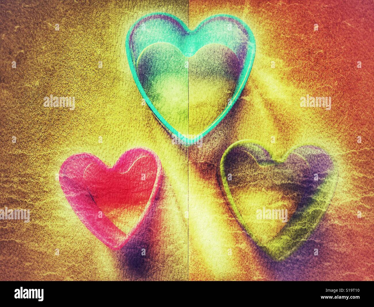 Three plastic heart shaped cookie cutters - Smartphone Captured Stock Image