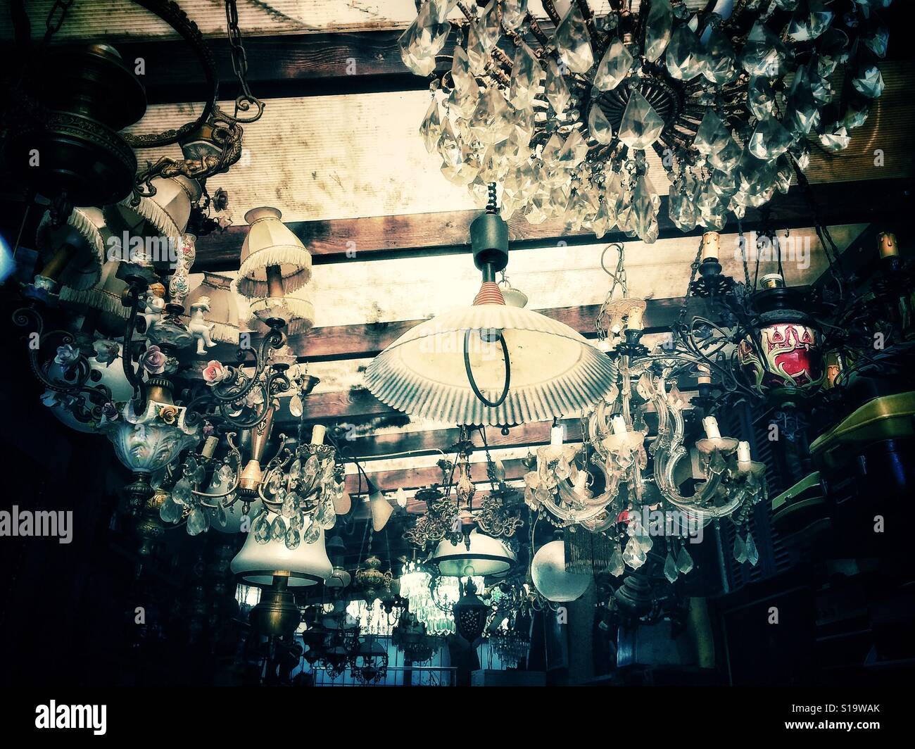 Light fixtures on display in an antique shop Stock Photo