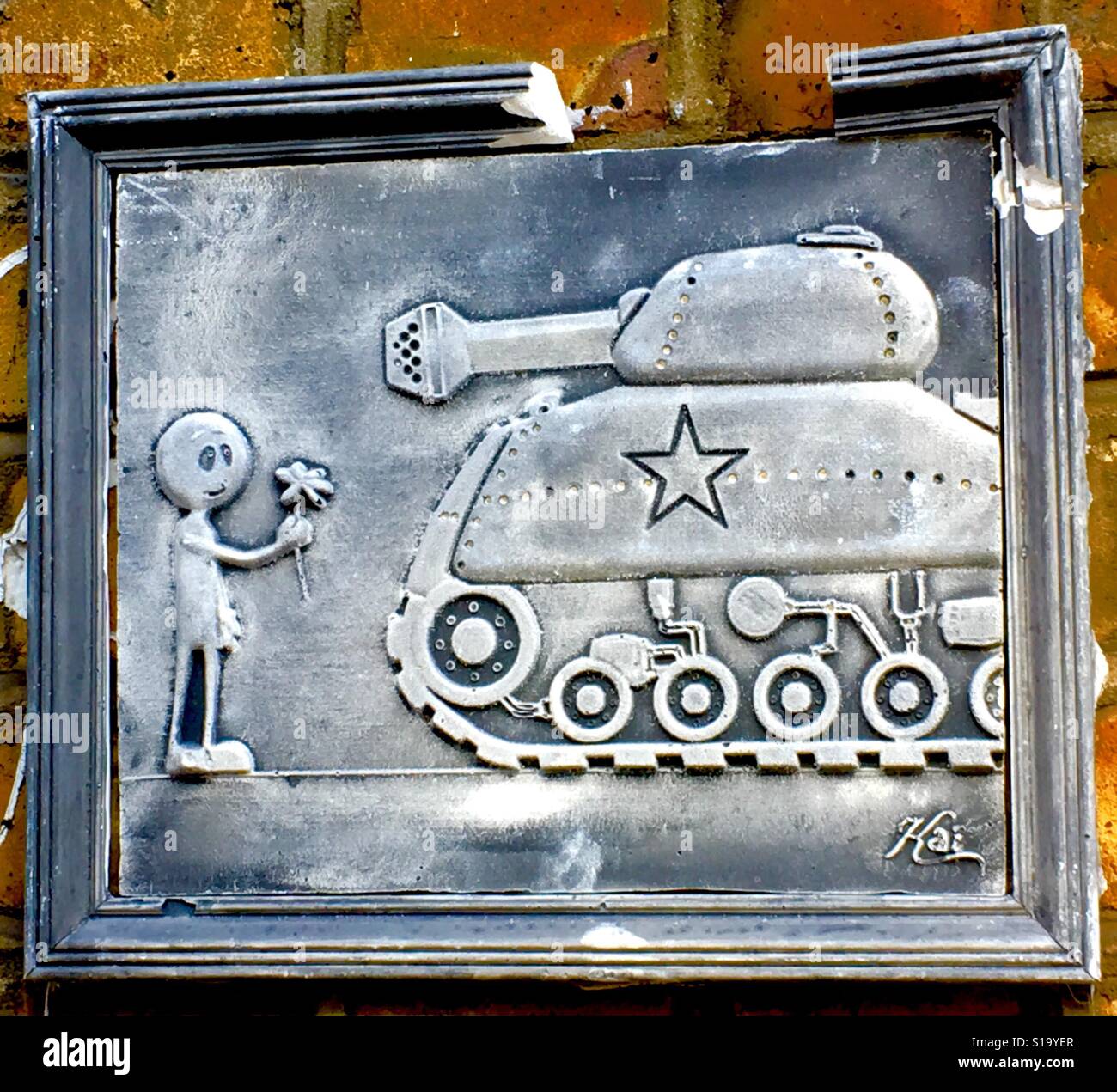 Stick Man Offering Flower to a Tank Old Street, London - Smartphone Captured Stock Image