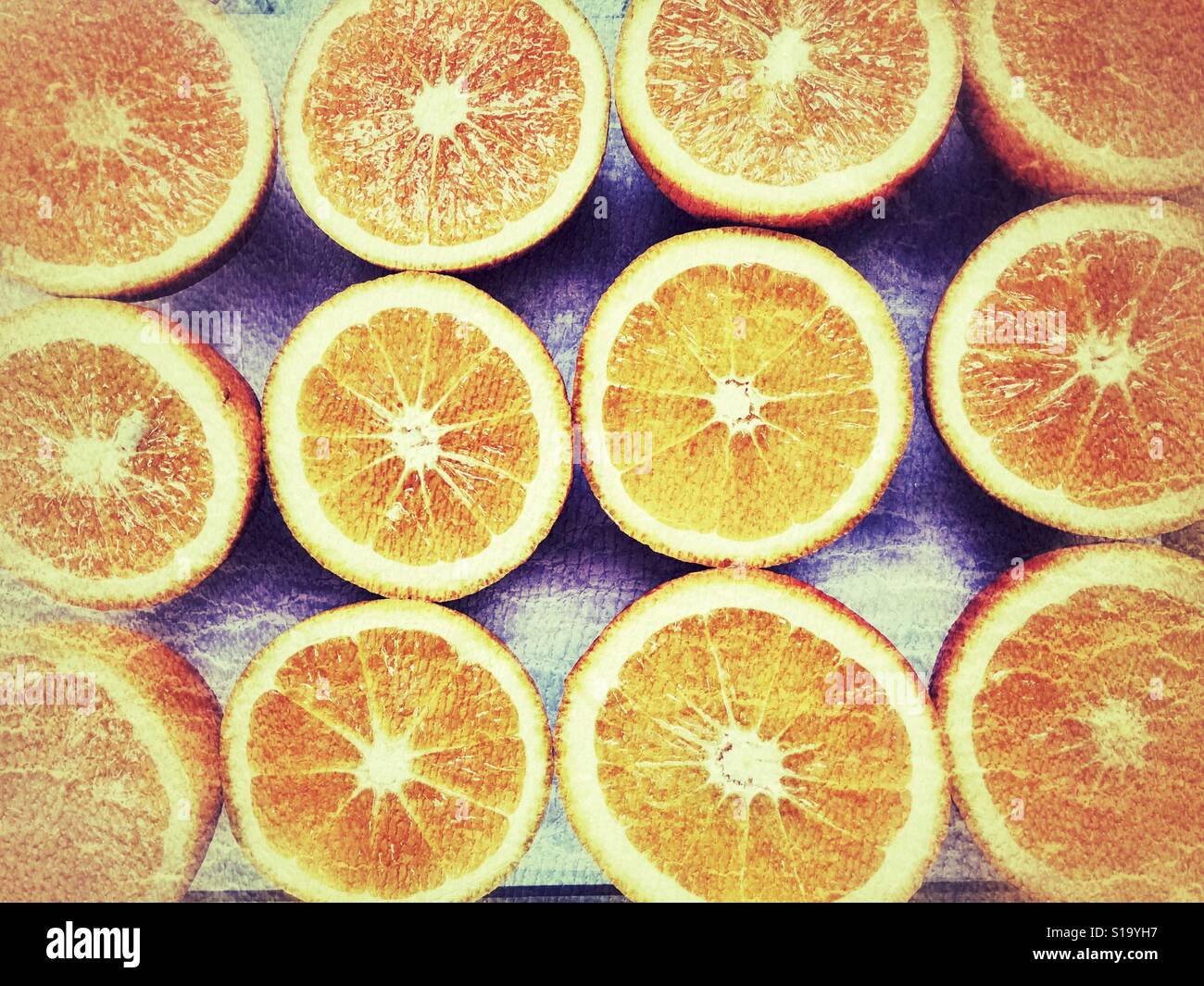 Oranges, cut in half, ready for juicing Stock Photo Alamy