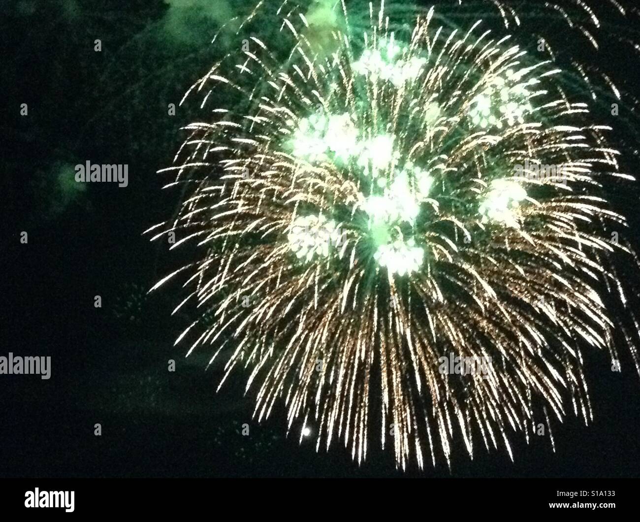 Green fireworks at night, bursting Stock Photo Alamy