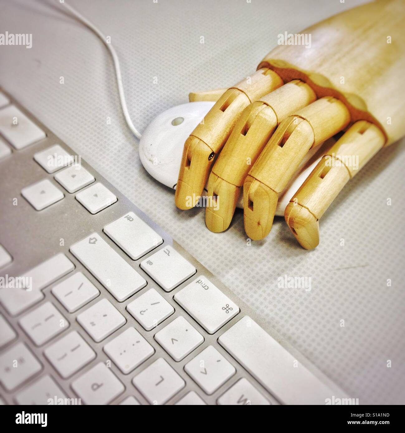 Robot hand on mouse with keyboard Stock Photo Alamy