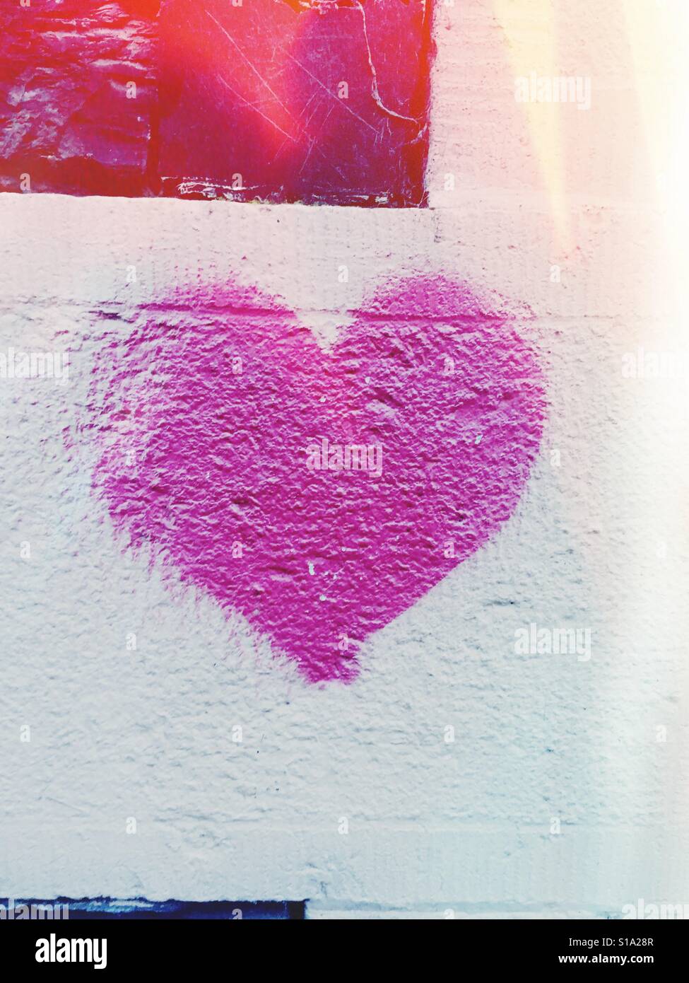 Love heart graphic graffiti on a wall Stock Photo