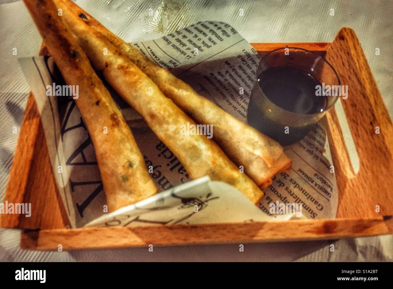Langoustine parcels with hot sauce in a tapas bar, Spain - Smartphone Captured Stock Image