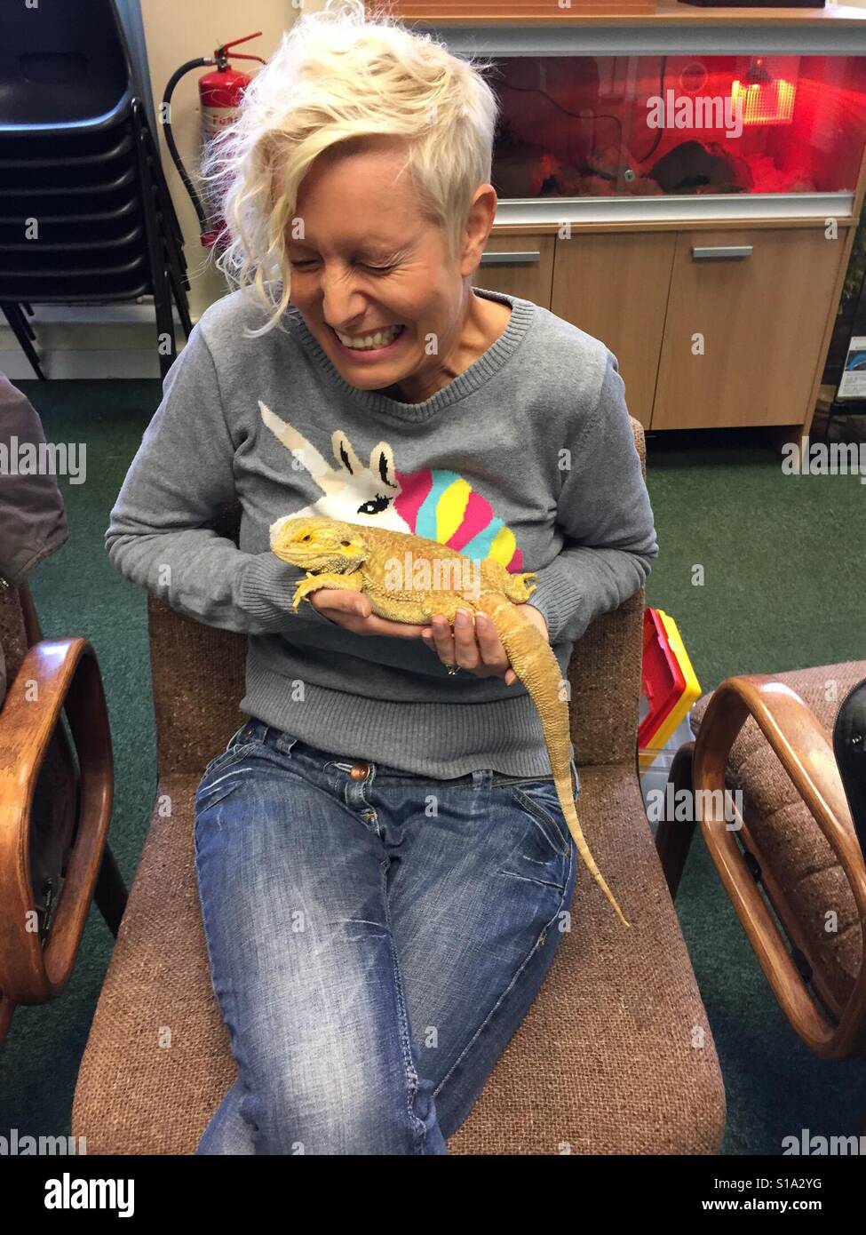 So excited to be holding an iguana! - Smartphone Captured Stock Image