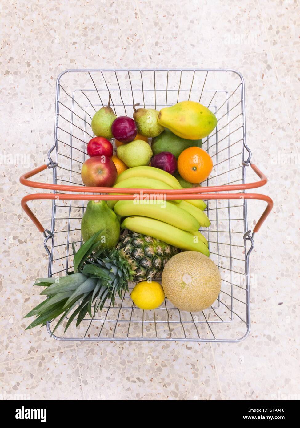 Shopping basket full of fruits Stock Photo Alamy