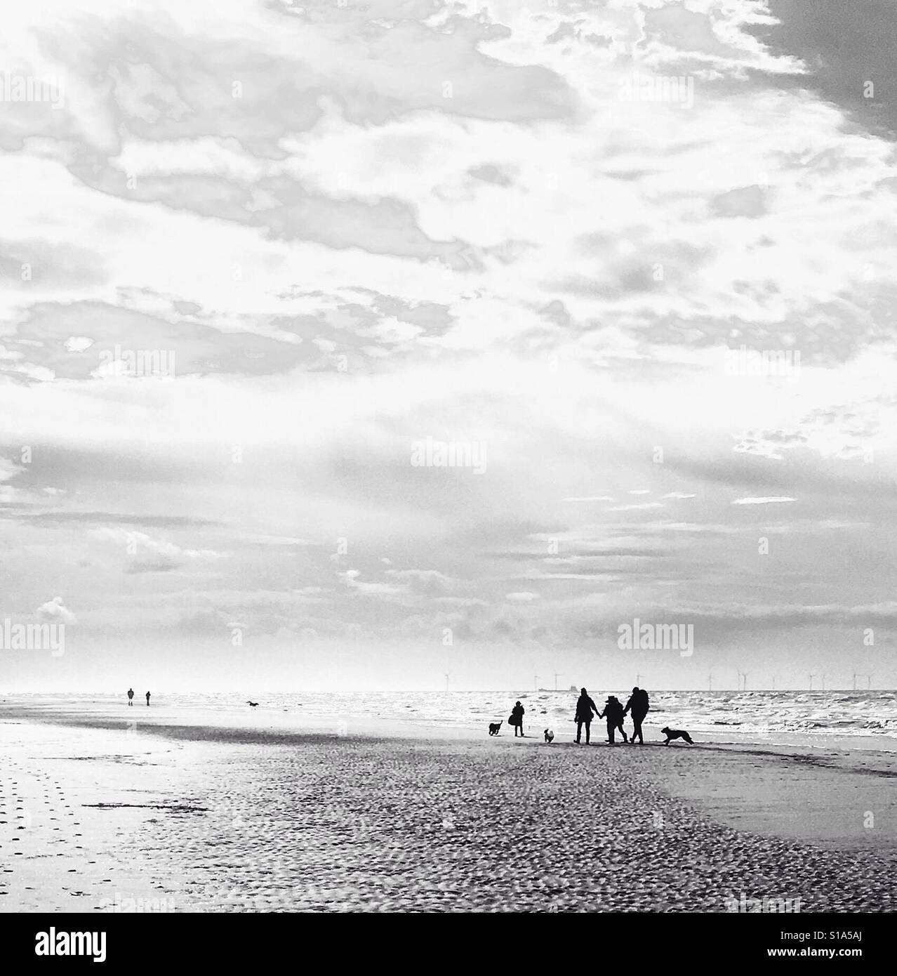 Family walking on a beach hi-res stock photography and images - Alamy