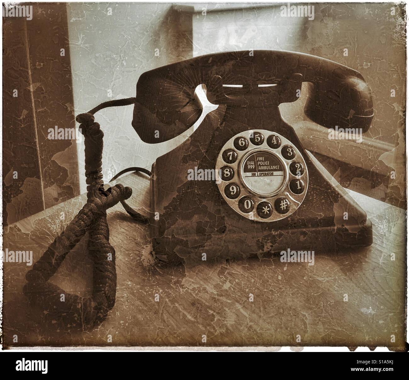 A retro effect picture of an old landline telephone showing dial and individual push button numbers. Photo Credit - © COLIN HOSKINS. - Smartphone Captured Stock Image