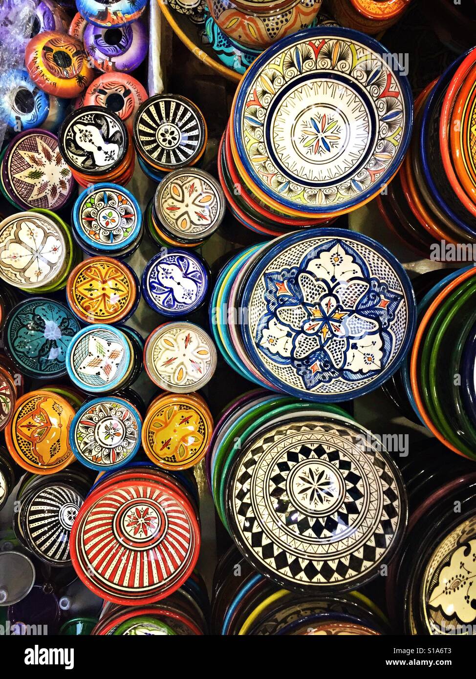 Hand-painted bowls for sale are seen on a market stall in Marakech, Morocco. Stock Photo
