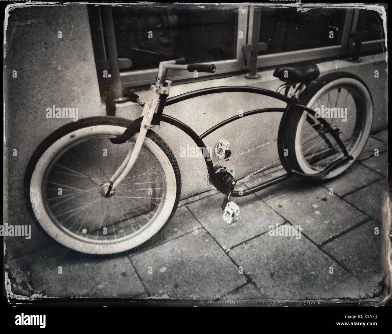 A faux tintype photograph of an unusual bicycle seen on a street in Bristol, UK - Smartphone Captured Stock Image