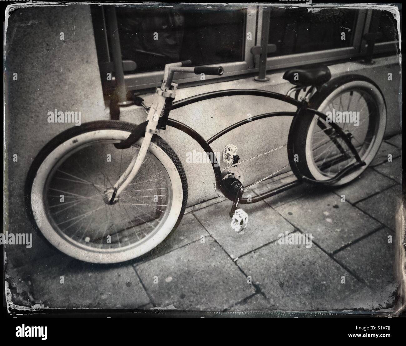 A faux tintype photograph of an unusual bicycle seen on a street in  Bristol, UK Stock Photo - Alamy