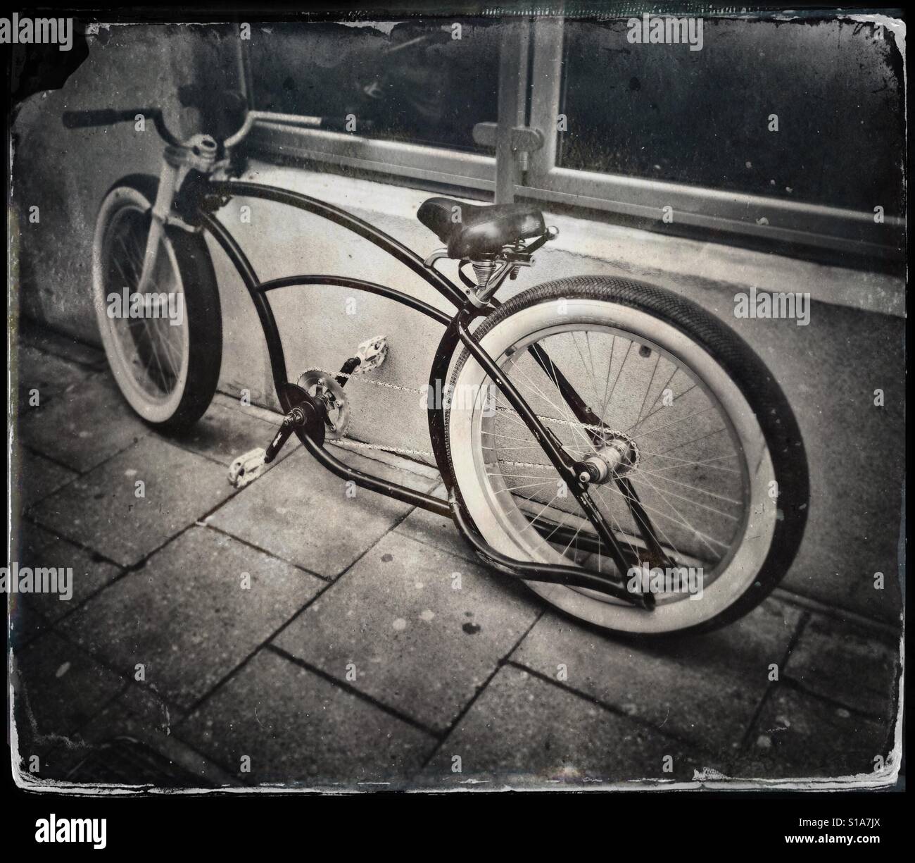 A faux tintype photograph of an unusual bicycle seen on a street in Bristol, UK - Smartphone Captured Stock Image