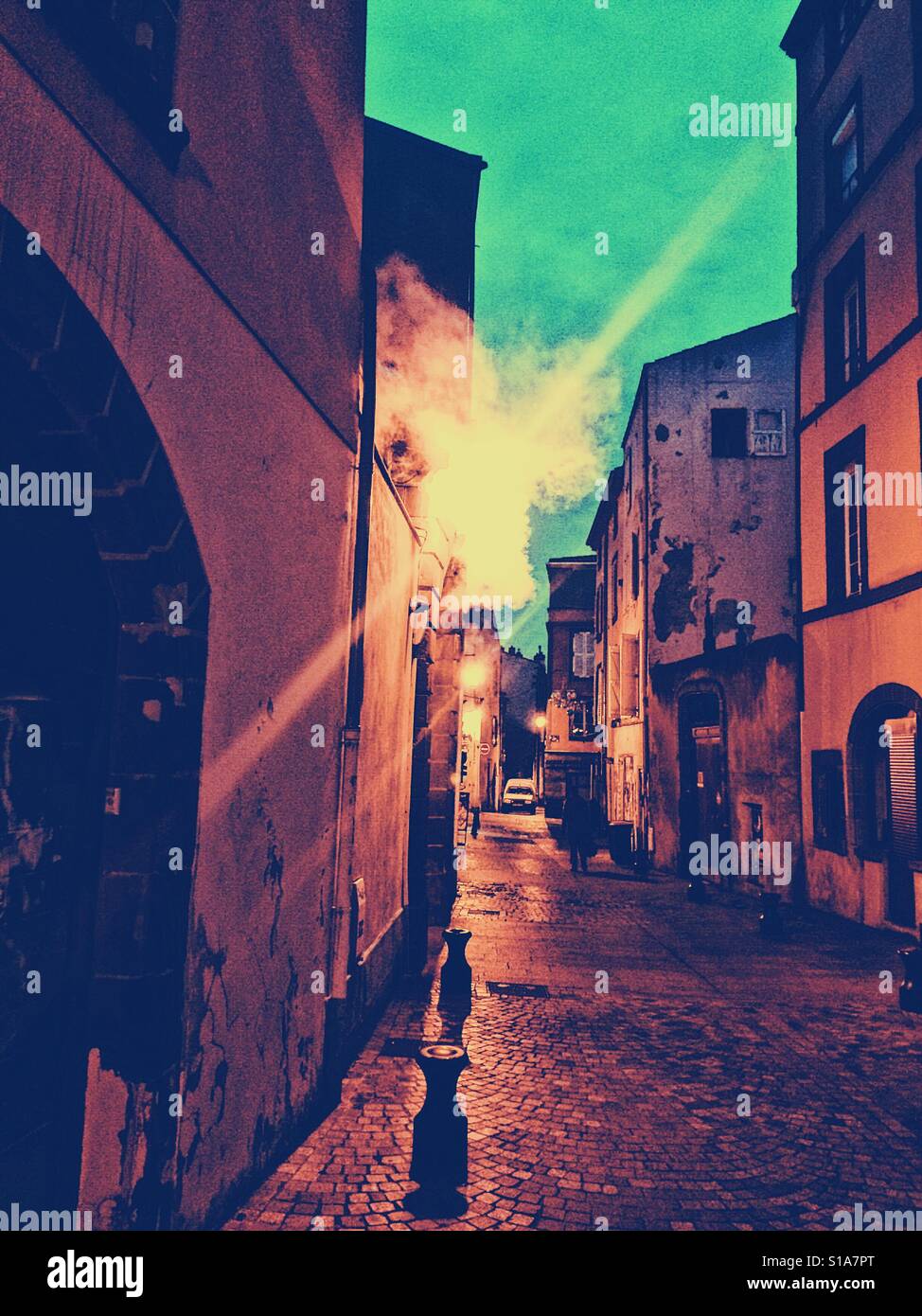 Smoke from flue in old town, Clermont Ferrand, Auvergne, France, Europe - Smartphone Captured Stock Image