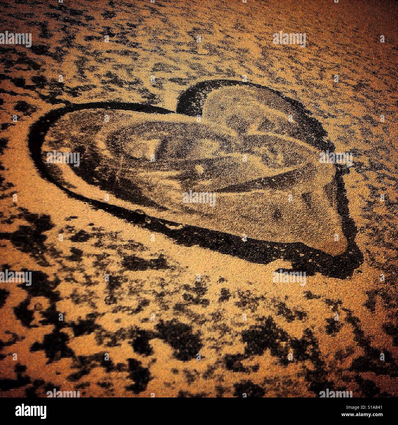 A heart made with sand in a car in Mexico City, Mexico - Smartphone Captured Stock Image