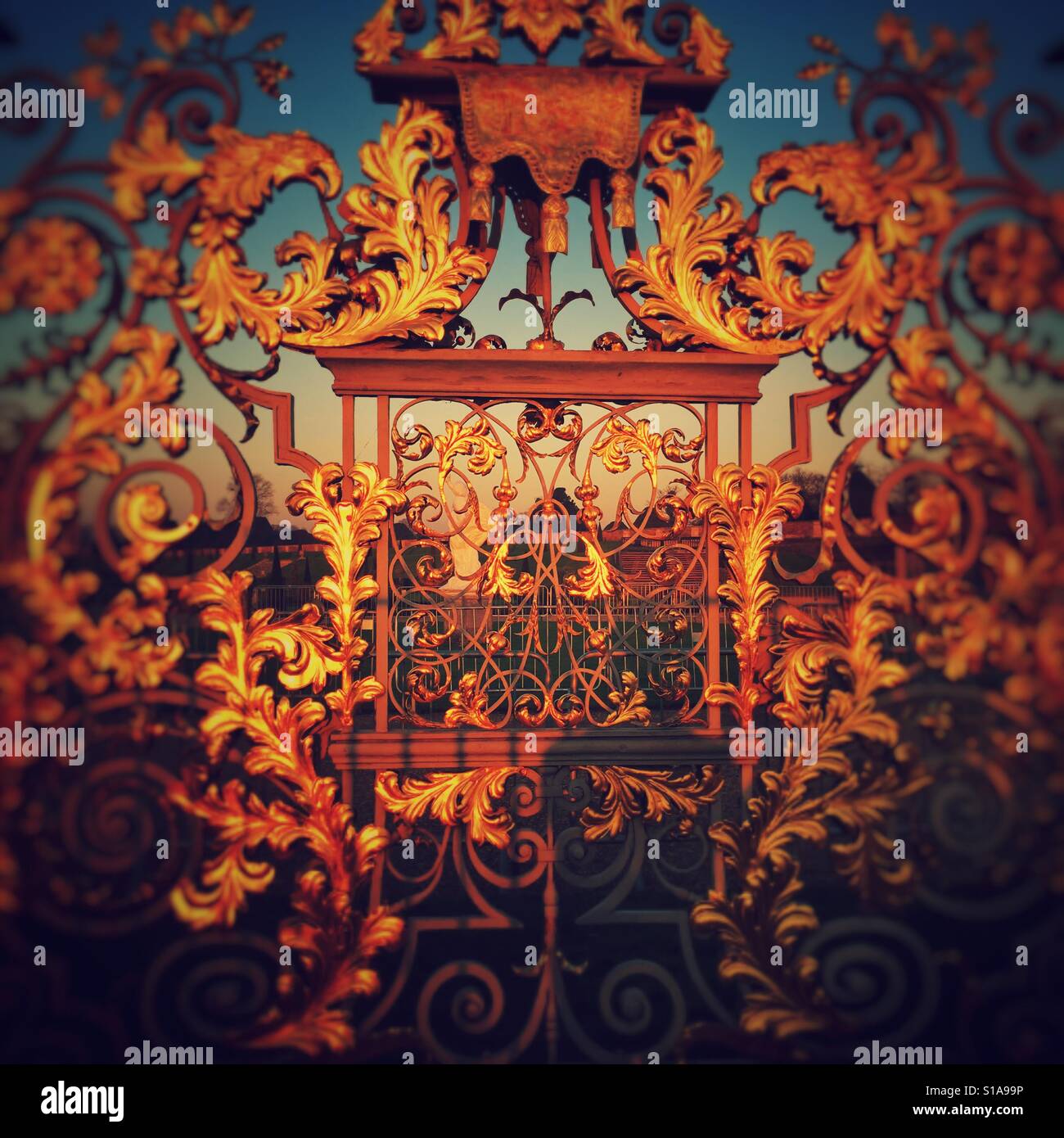 Gold guilded gate at Hampton Court Palace, East Molesey, Surrey, England - Smartphone Captured Stock Image