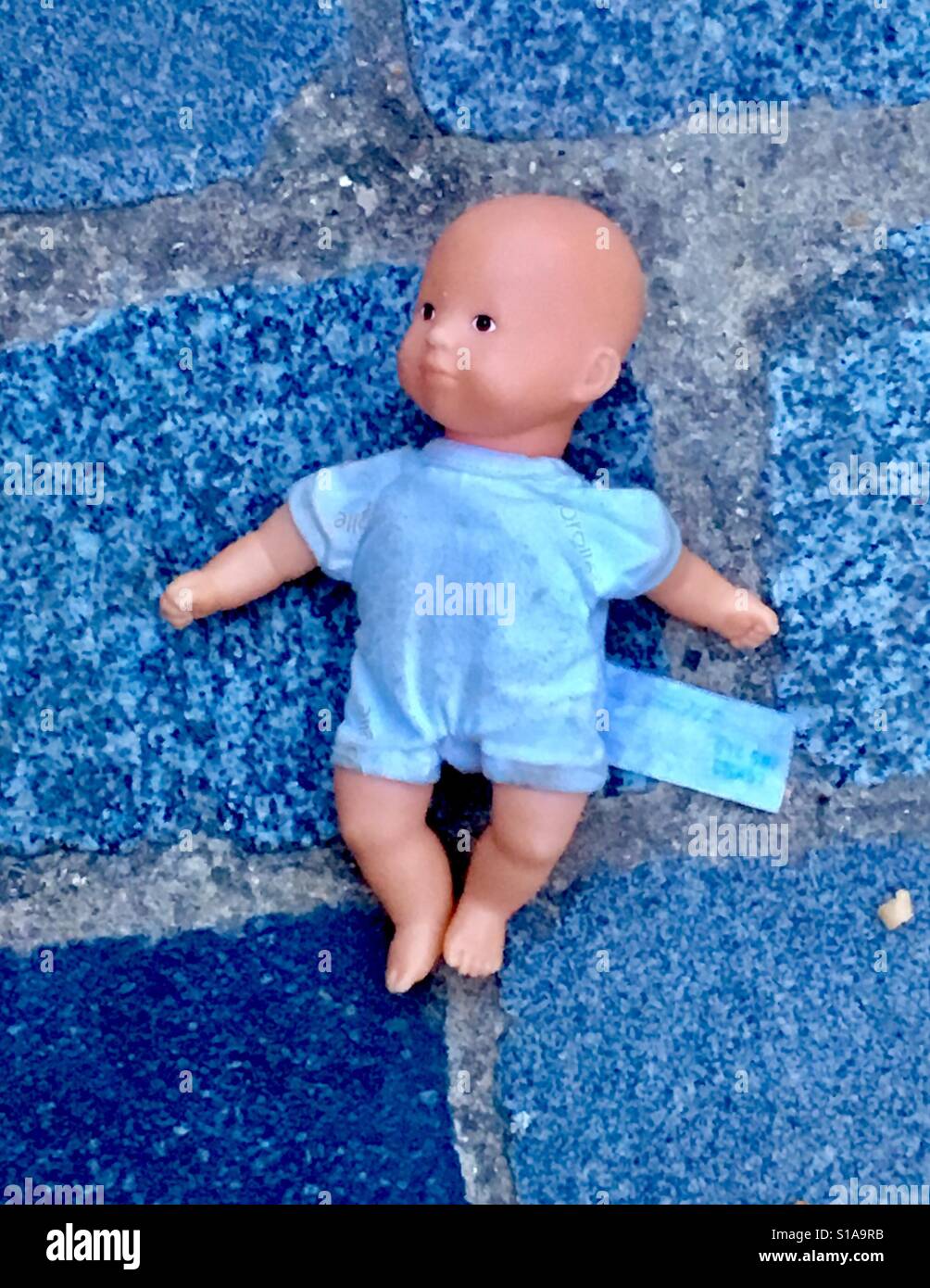 Baby Doll Lost on the Streets of Paris - Smartphone Captured Stock Image