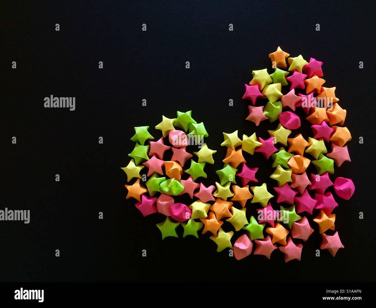 Folding paper making stars Stock Photo Alamy