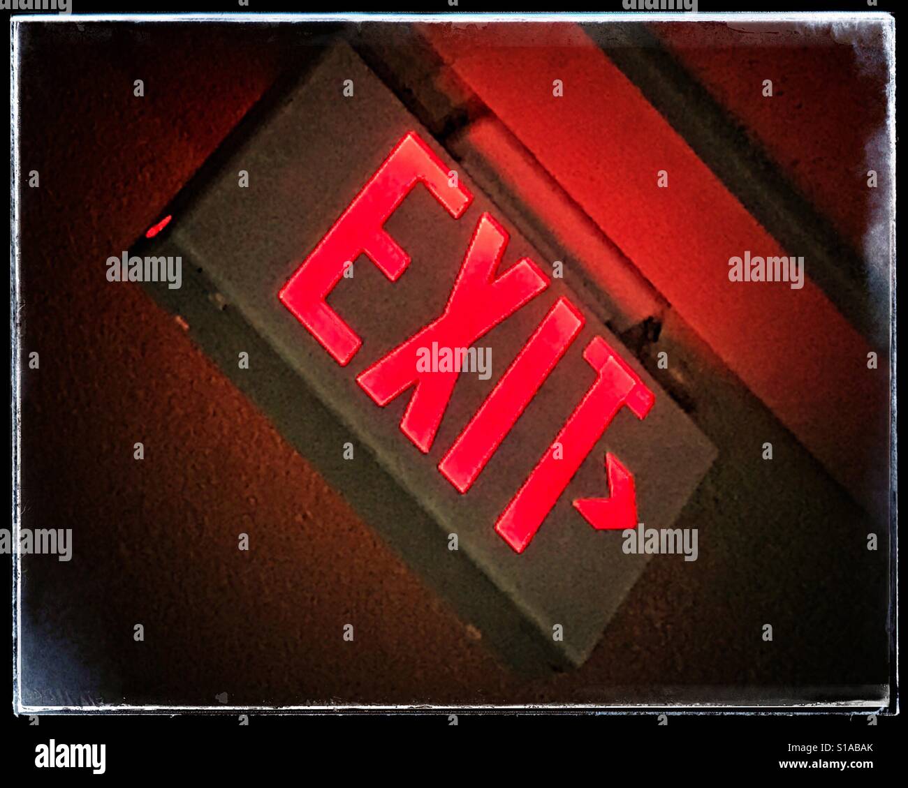 Red exit sign on a tilt - Smartphone Captured Stock Image