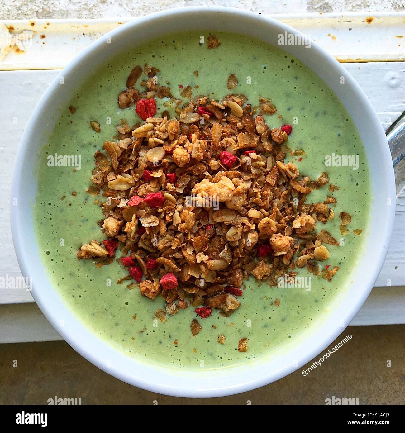 green smoothie topped with granola Stock Photo