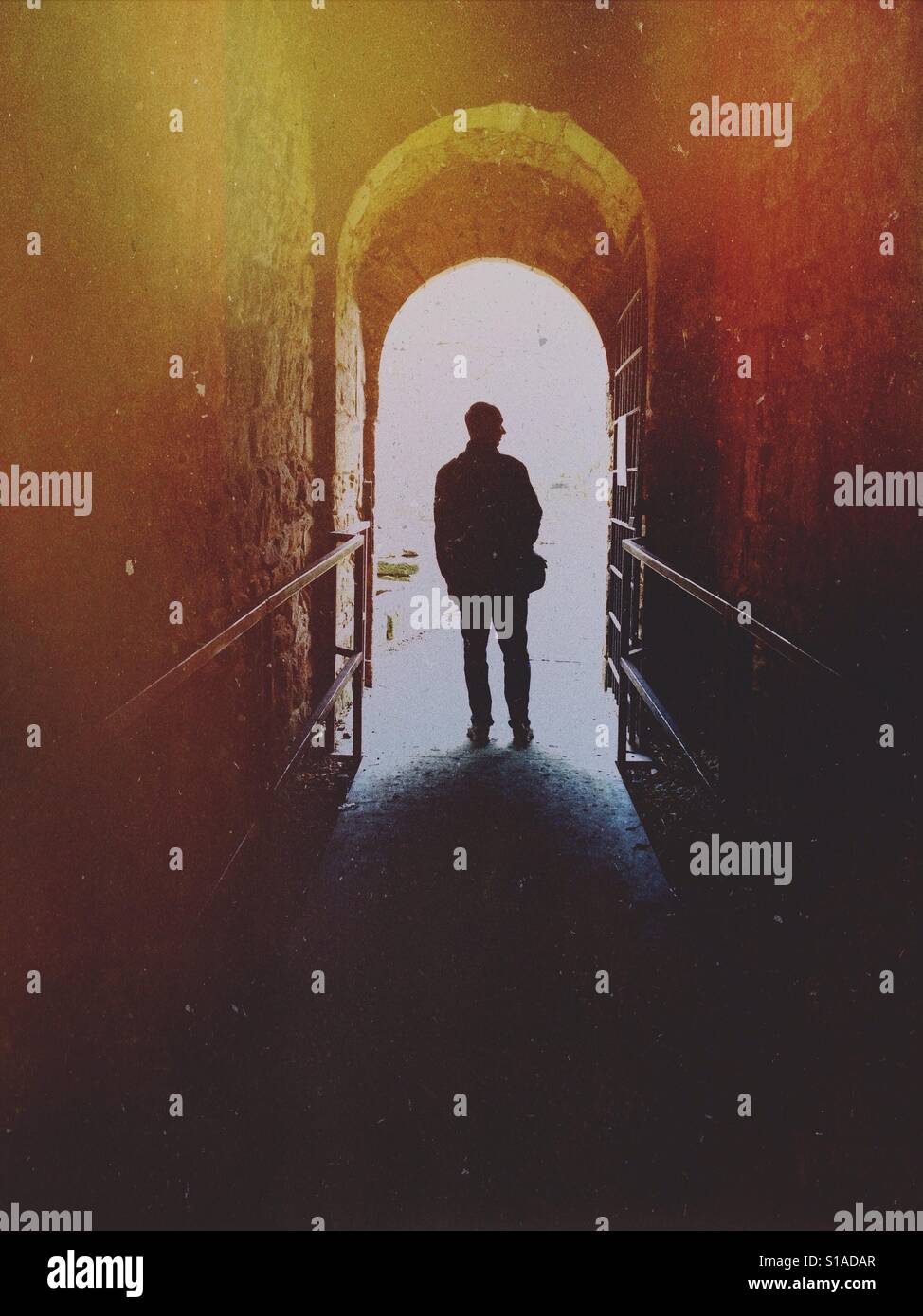 Silhouette of a Man at the end of a tunnel - Smartphone Captured Stock Image