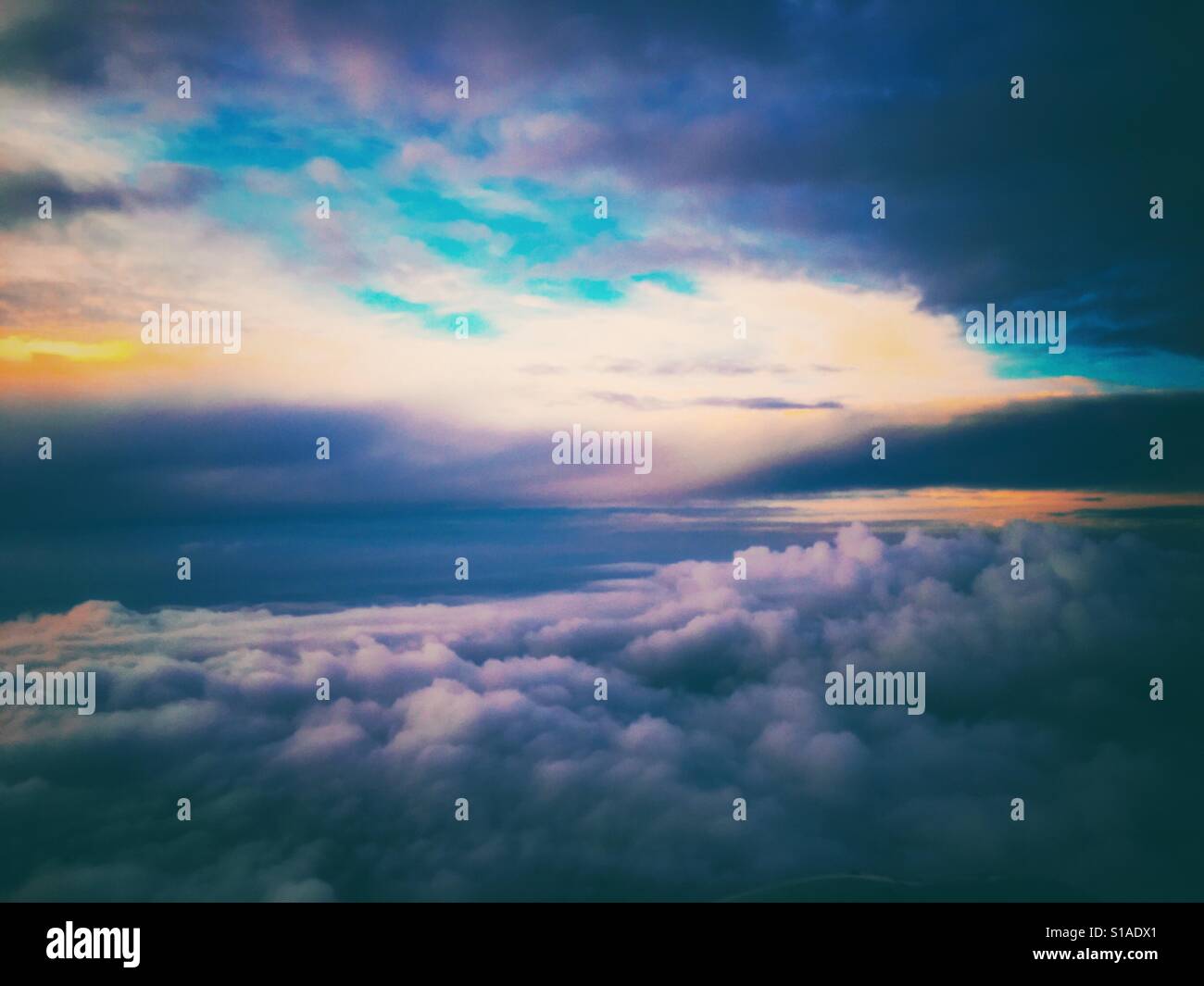 Dramatic purple cloudscape seen from the air close up dreamscape blue sky yellow sun taken above the Midwest Columbus Ohio USA at twilight beautiful background copy space - Smartphone Captured Stock Image