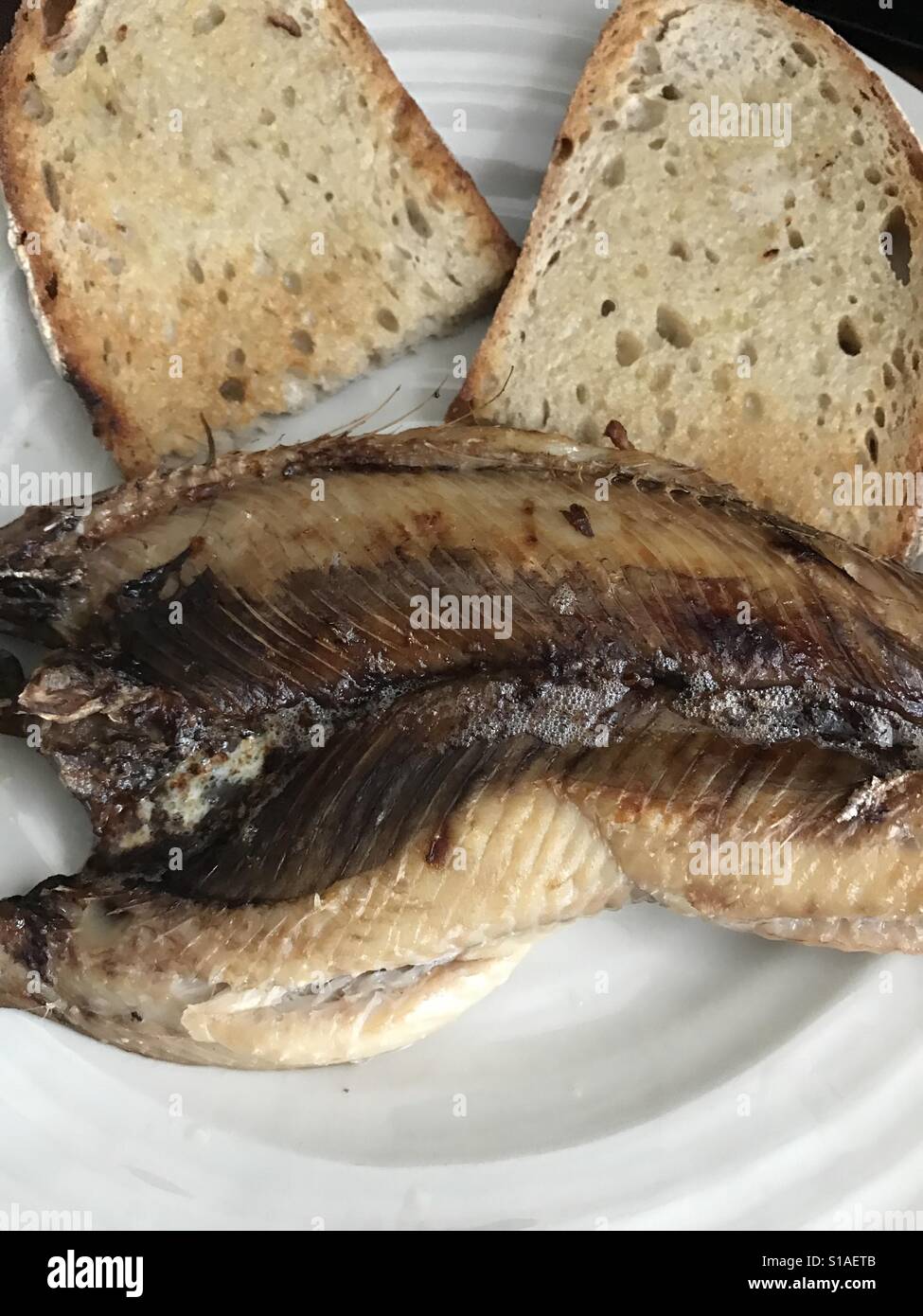 Kippers and toasted bread Stock Photo Alamy