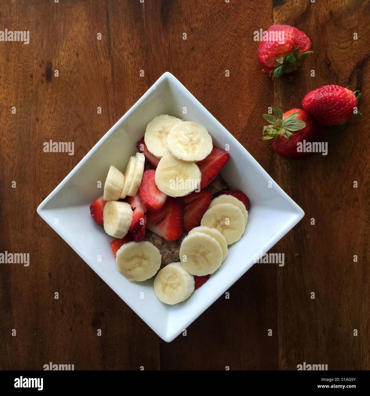 Fresh chopped fruit on top of oatmeal porridge - Smartphone Captured Stock Image