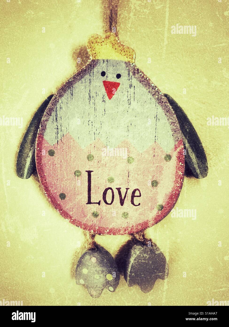 Painted wood love bird hanging ornament Stock Photo