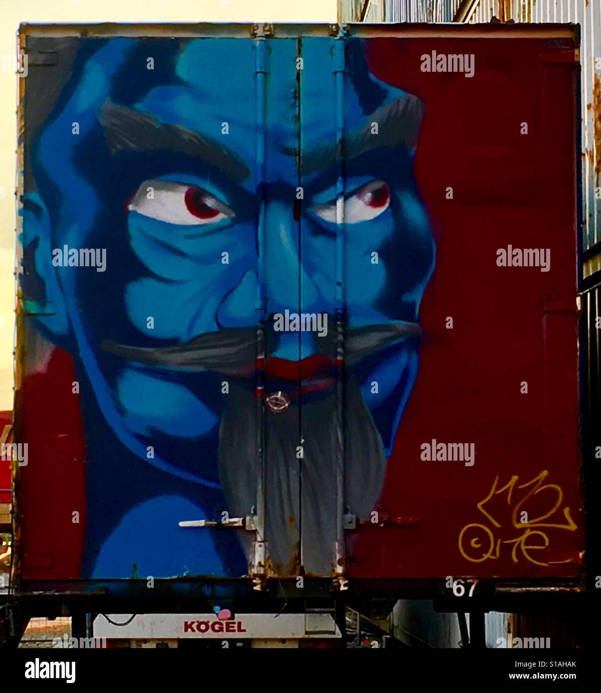 Wizard looking man painted on the back of a lorry. Munich, Germany - Smartphone Captured Stock Image